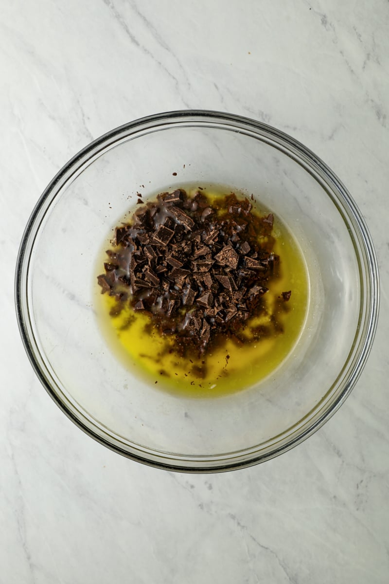 Chocolate and melted butter in glass bowl.
