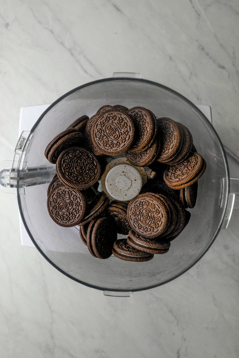 Oreo cookies in food processor bowl.