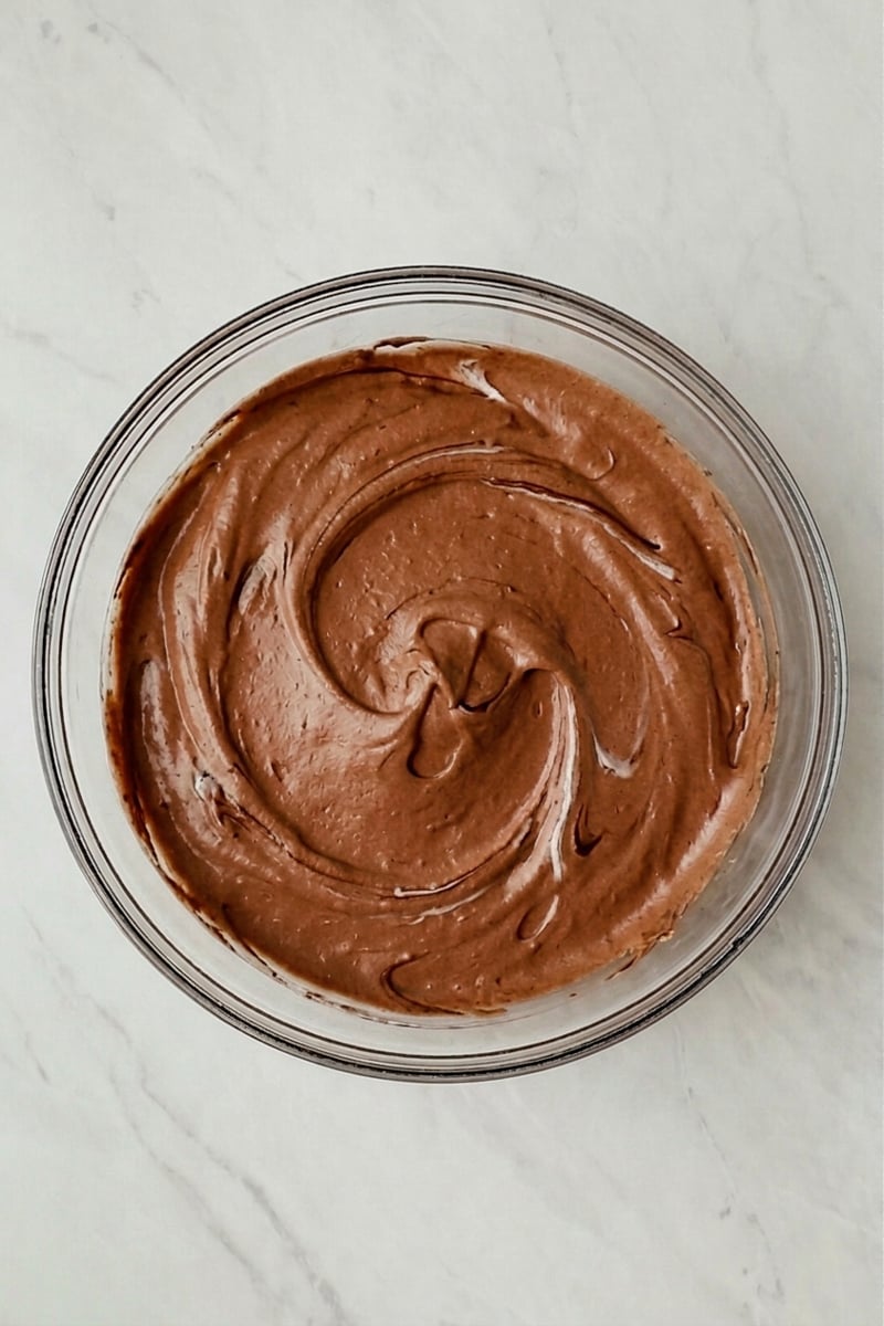 Chocolate mousse filling in glass bowl.