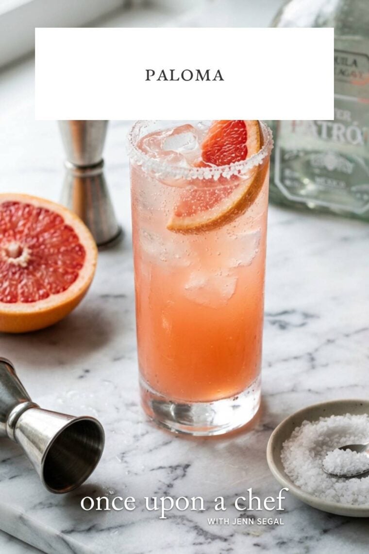 marble counter with paloma cocktail garnished with grapefruit slice