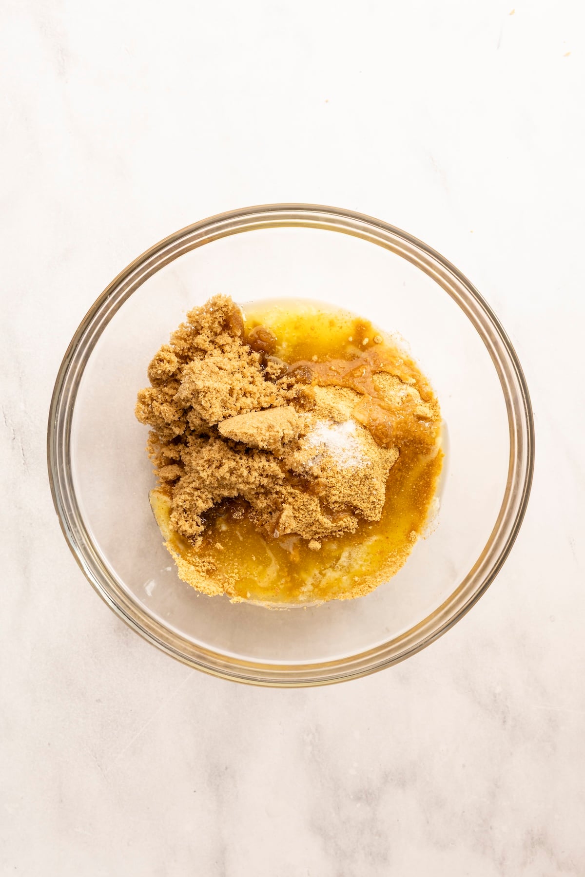 small bowl with graham cracker crumbs, melted butter, brown sugar, and salt
