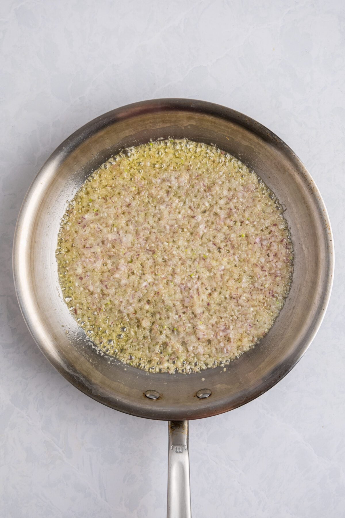 shallots cooking in large skillet