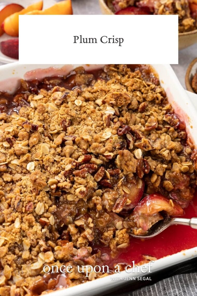 plum crisp with spoon scooping out portion