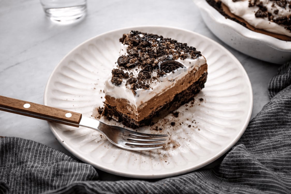 Slice of Mississippi mud pie on plate with fork