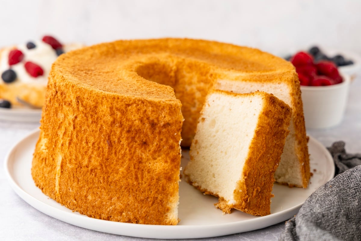 Sliced angel food cake on platter.