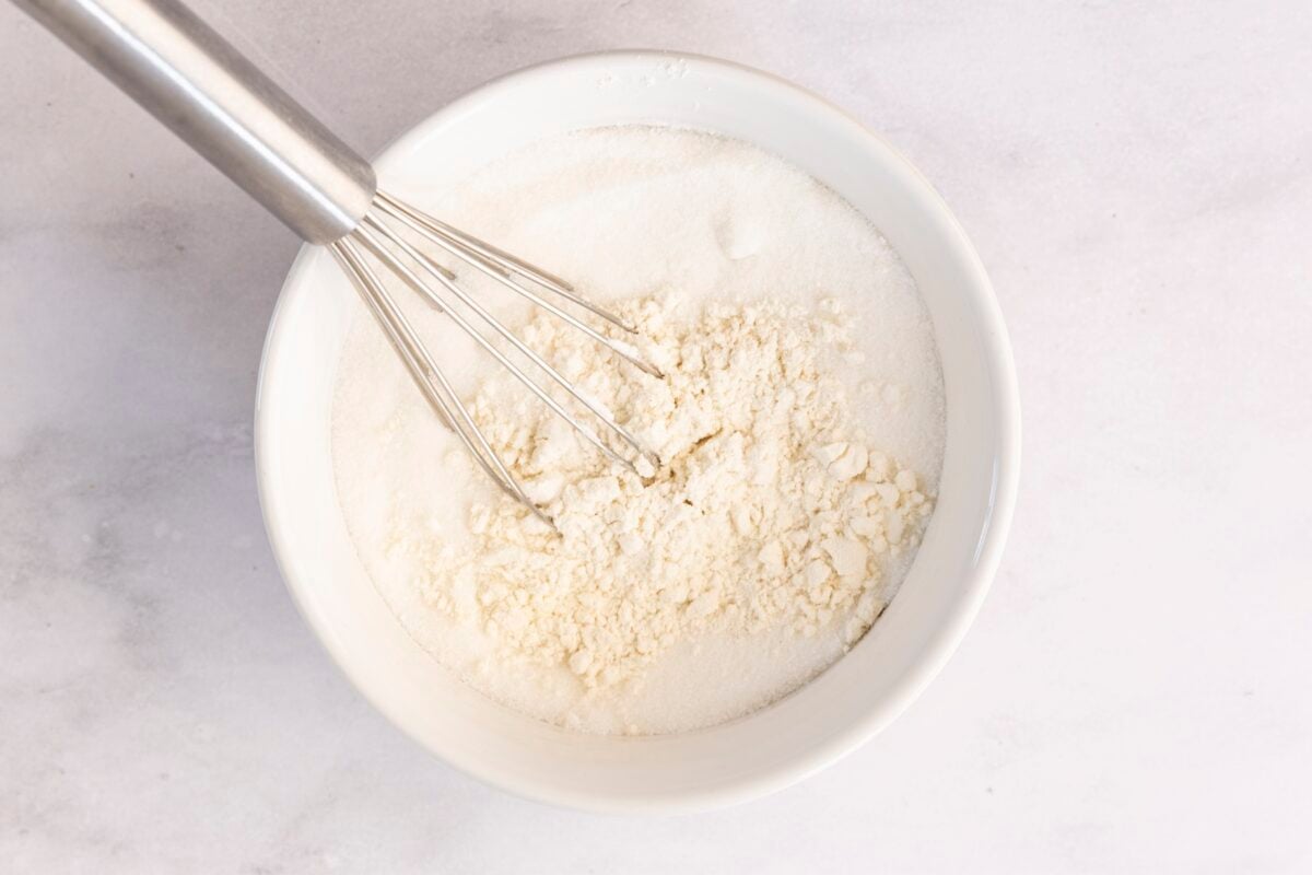 whisking dry ingredients in mixing bowl