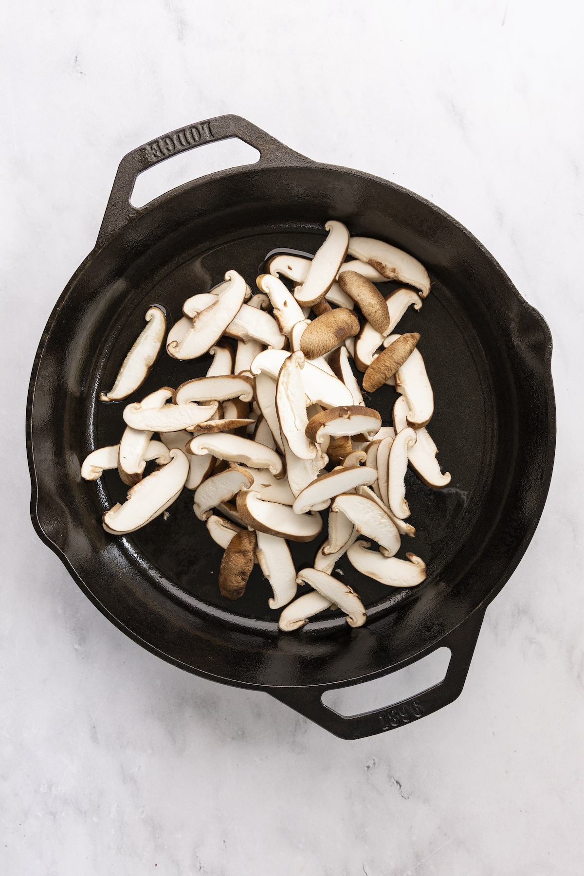 Mushrooms in cast iron skillet.