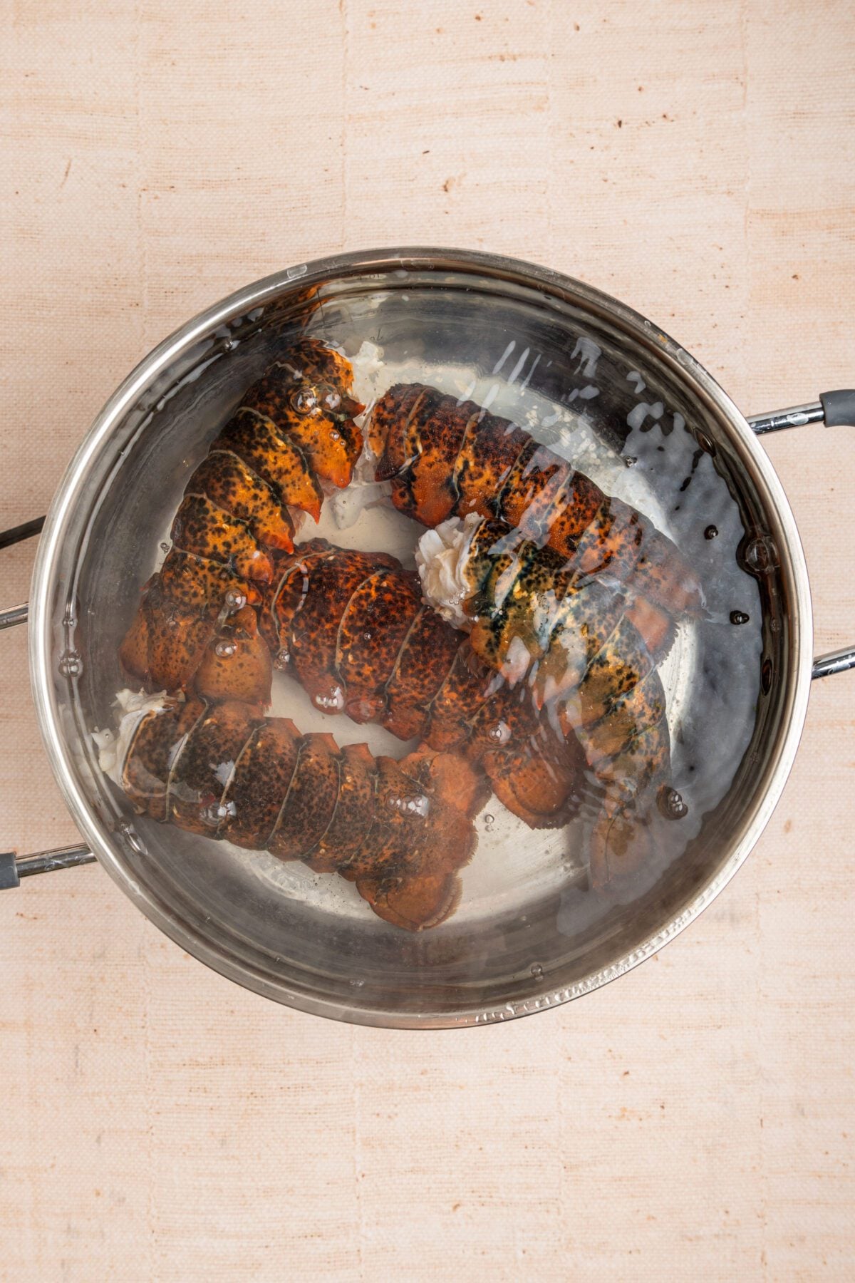 lobster tails cooking in very large pot