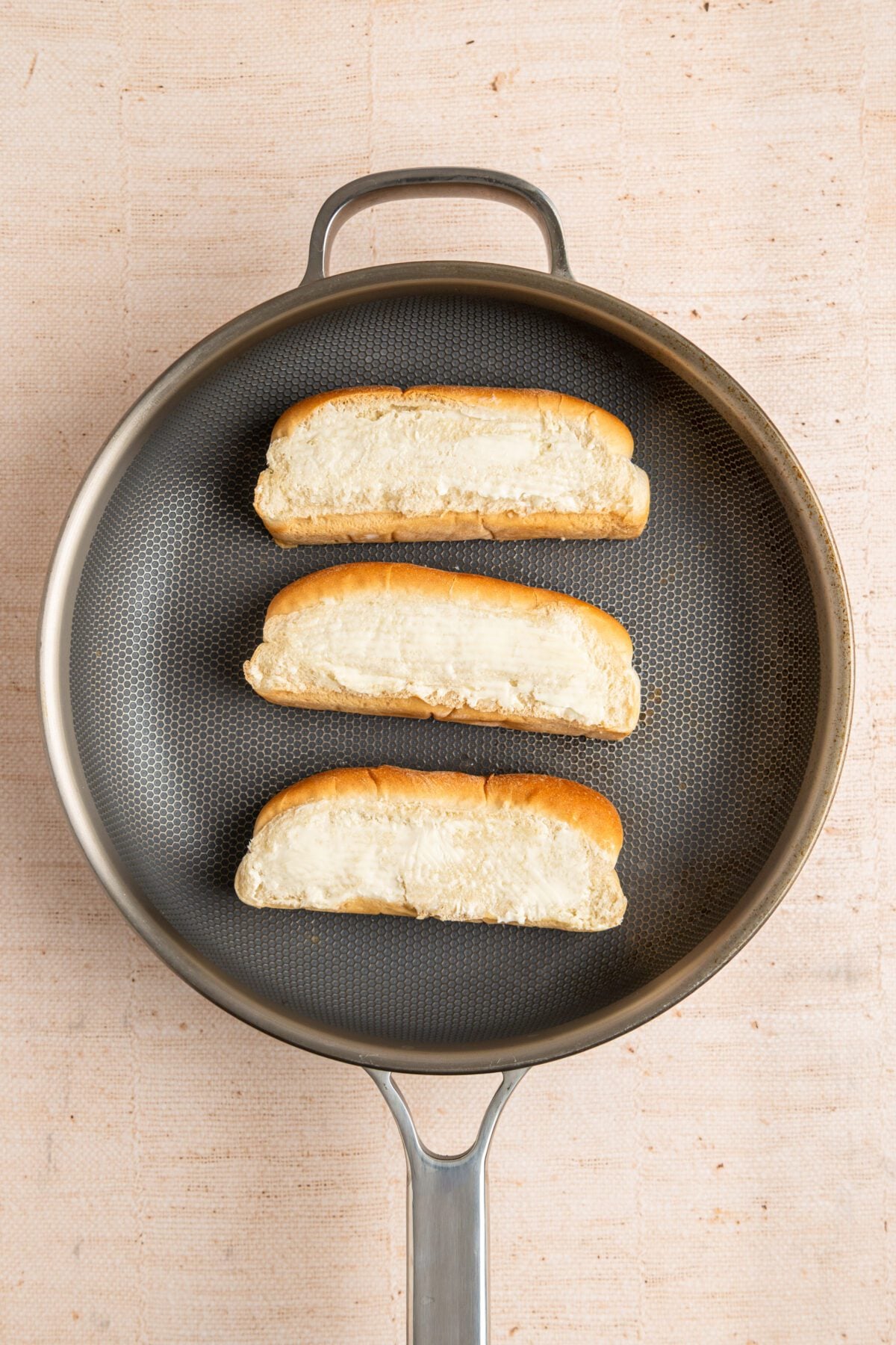 3 buns cooking in medium nonstick skillet