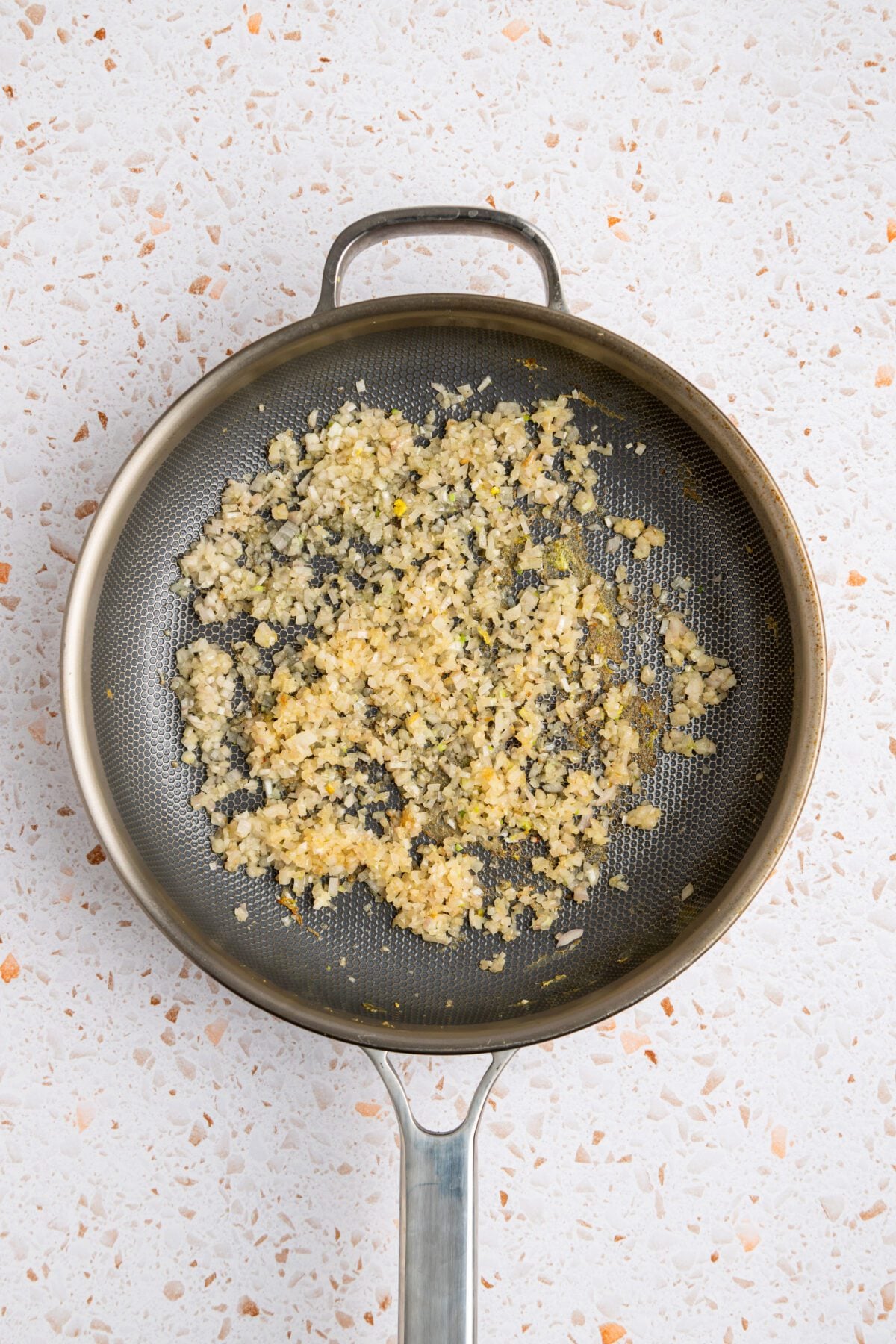 Cooked shallots in skillet
