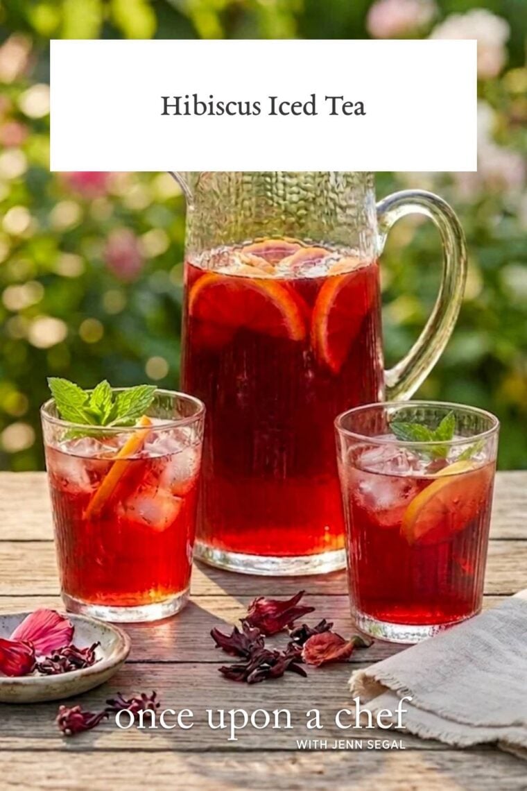 pitcher and two glasses of hibiscus iced on wood table