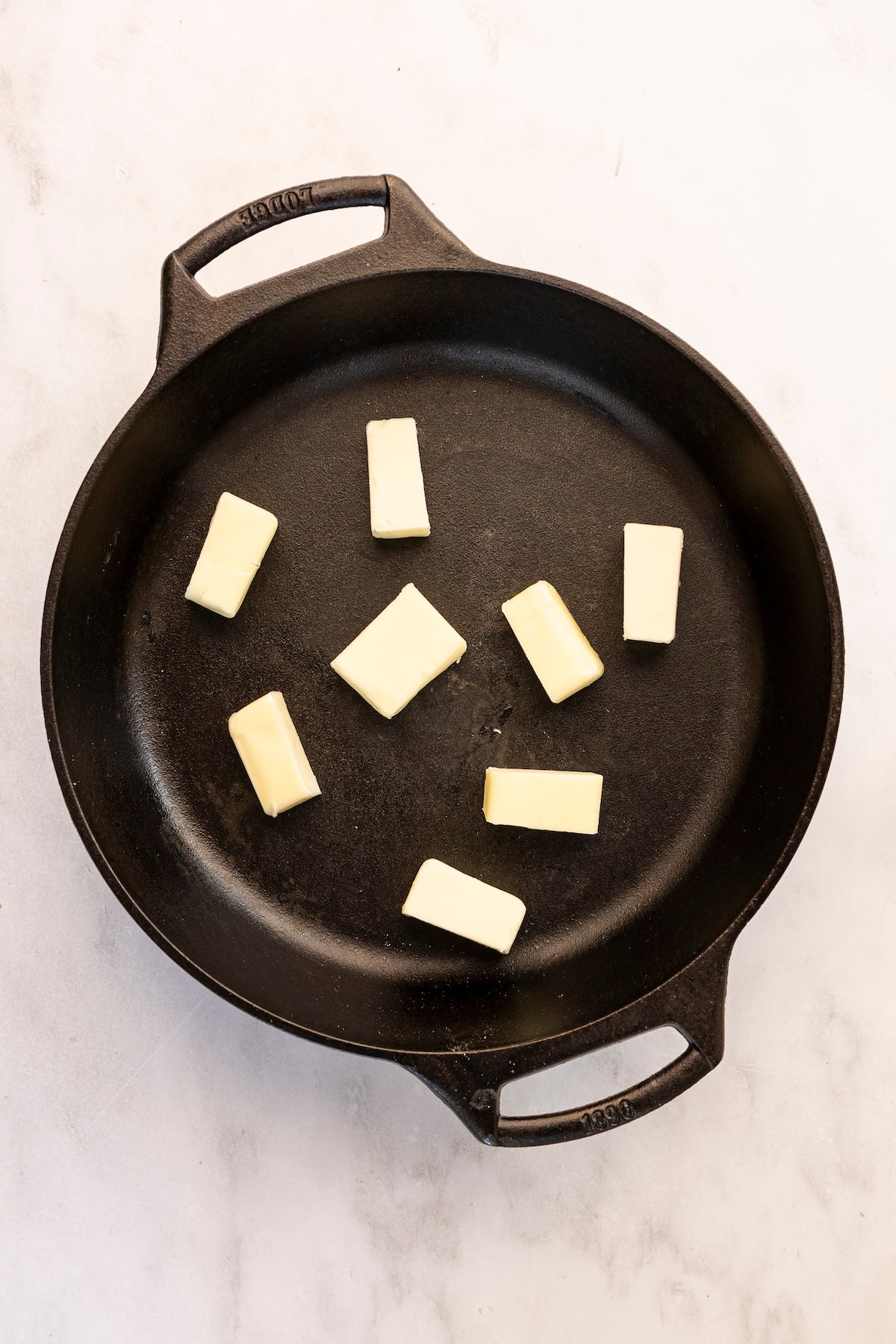 chunks of butter in cast iron skillet