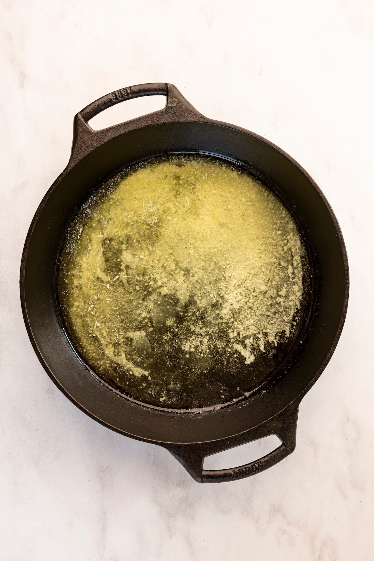 melted butter in cast iron skillet